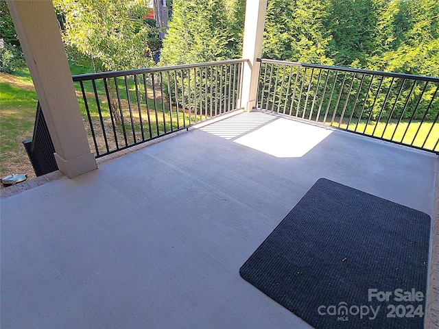 view of patio with a balcony