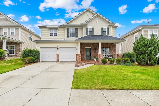 view of front of property with a garage and a front yard