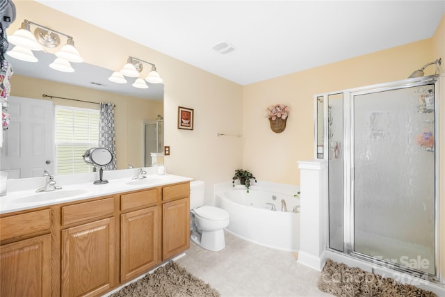 full bathroom with toilet, vanity, and separate shower and tub