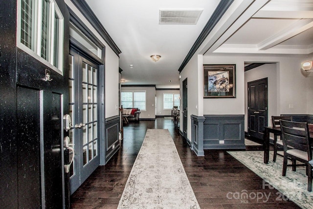 hall featuring french doors, ornamental molding, and dark hardwood / wood-style flooring