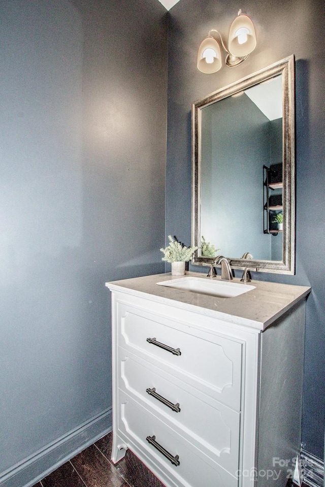 bathroom featuring vanity and hardwood / wood-style flooring