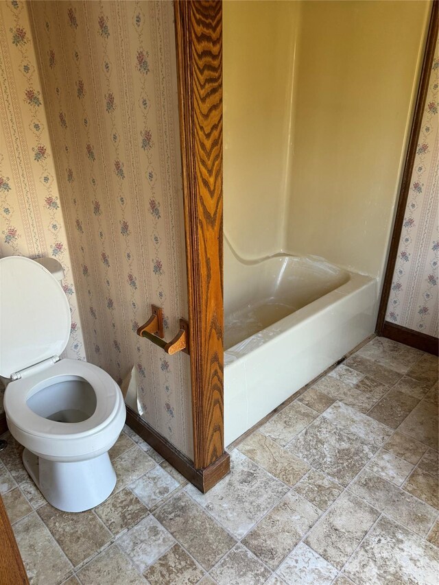 bathroom with independent shower and bath and toilet