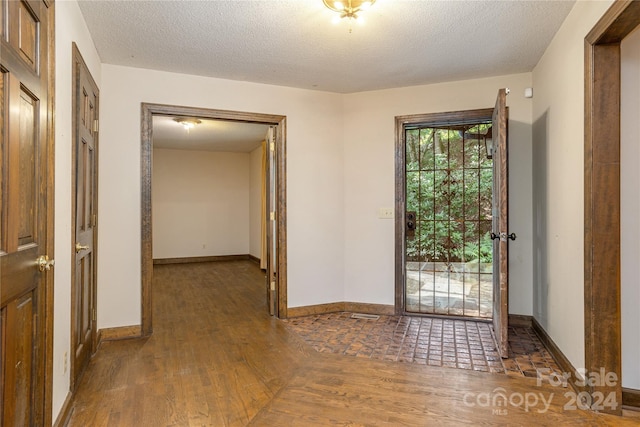 120 Pinewood Cir, Laurel Park, NC 28739 - interior space with a textured ceiling, wood finished floors, and baseboards