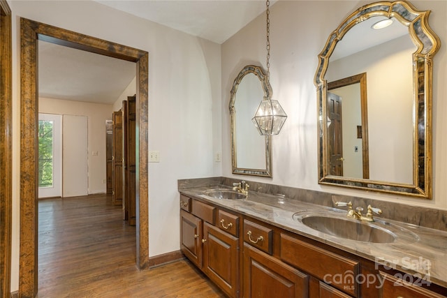 120 Pinewood Cir, Laurel Park, NC 28739 - full bath with double vanity, a sink, wood finished floors, and baseboards