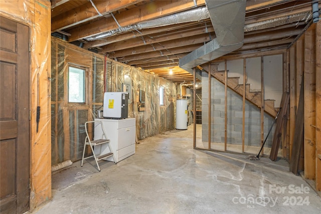 120 Pinewood Cir, Laurel Park, NC 28739 - below grade area featuring stairway, washer / dryer, and gas water heater