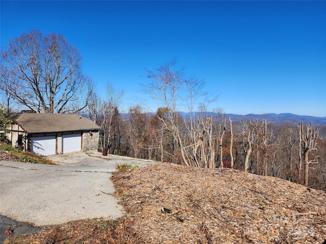 exterior space with a mountain view and a garage