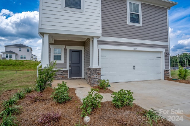 exterior space with a front yard and a garage