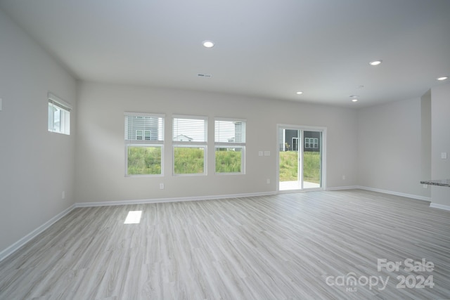 spare room featuring light wood-type flooring