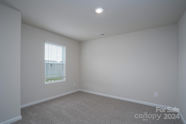 spare room featuring carpet flooring