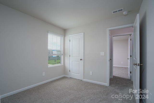 unfurnished bedroom featuring carpet floors