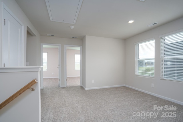 carpeted spare room with a healthy amount of sunlight