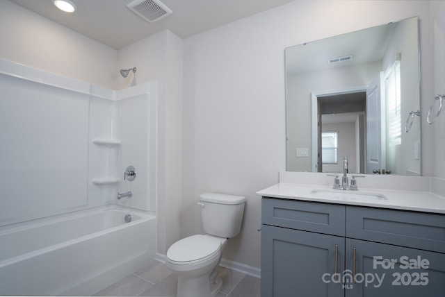 full bathroom featuring vanity, tile patterned flooring, shower / washtub combination, and toilet