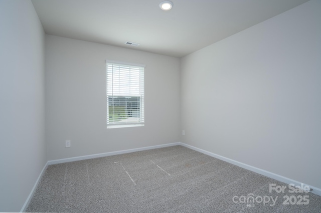 spare room with carpet floors