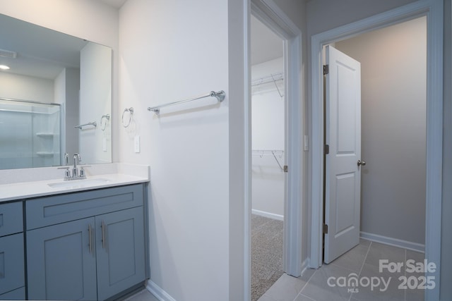 bathroom featuring tile patterned floors and vanity