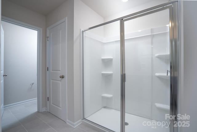 bathroom featuring tile patterned floors and walk in shower