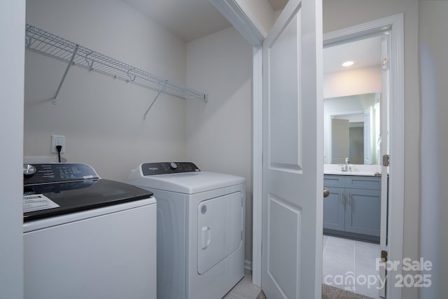 laundry room featuring sink and washing machine and dryer