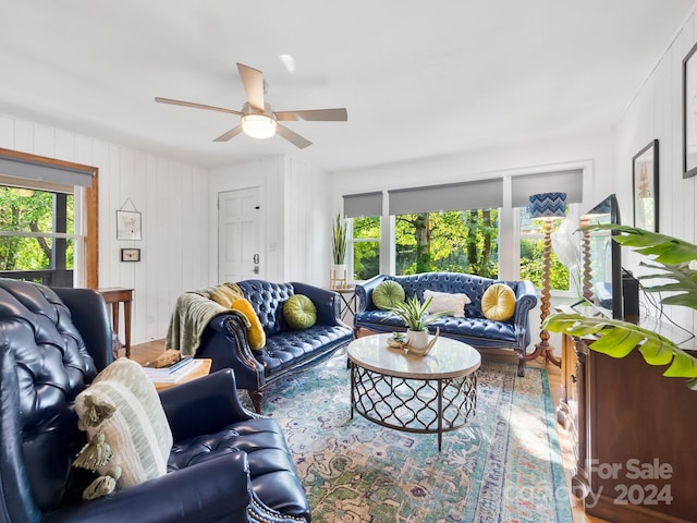 living room with ceiling fan, hardwood / wood-style flooring, and plenty of natural light