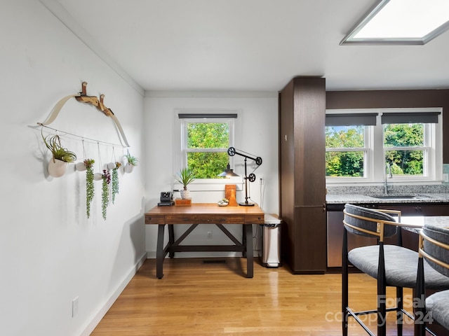 office featuring sink and light wood-type flooring