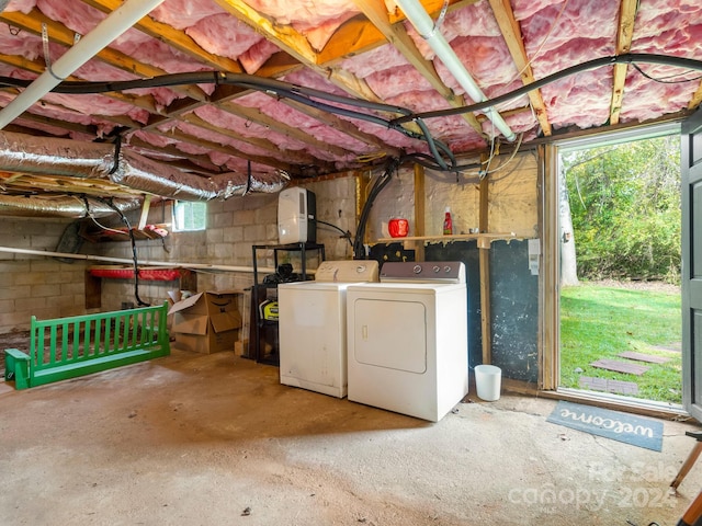 basement featuring a wealth of natural light and washing machine and dryer