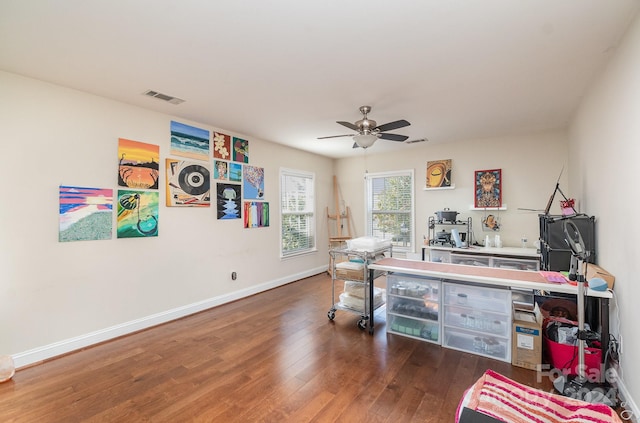 office featuring dark hardwood / wood-style flooring and ceiling fan