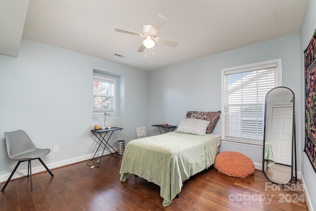 bedroom featuring ceiling fan and dark hardwood / wood-style floors