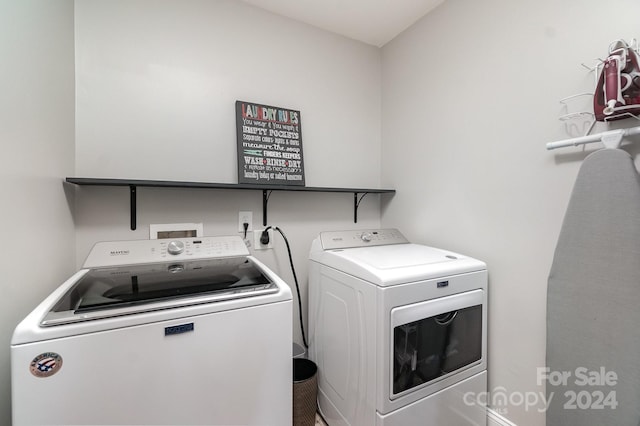 clothes washing area with independent washer and dryer