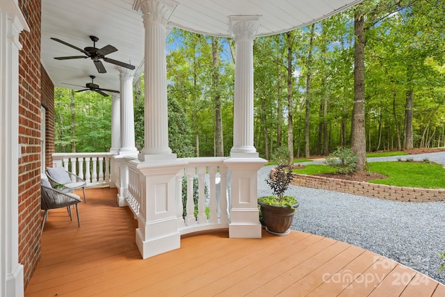 wooden terrace featuring ceiling fan and covered porch