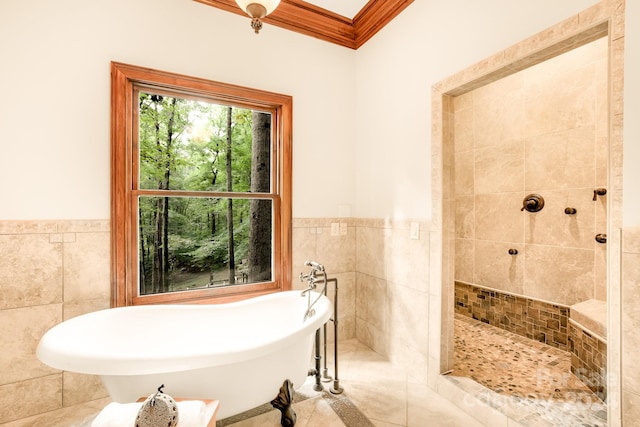 bathroom with tile walls, tile patterned flooring, ornamental molding, and plus walk in shower