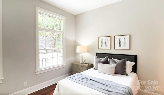 bedroom featuring dark hardwood / wood-style floors