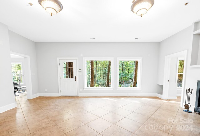 10250 Barringer Ct, Mount Pleasant, NC 28124 - interior space featuring baseboards, a wealth of natural light, visible vents, and light tile patterned floors