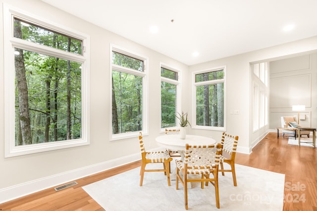 dining area with light hardwood / wood-style flooring and plenty of natural light