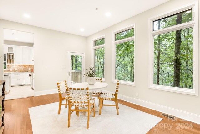 10250 Barringer Ct, Mount Pleasant, NC 28124 - dining room featuring baseboards, recessed lighting, visible vents, and light wood-style floors