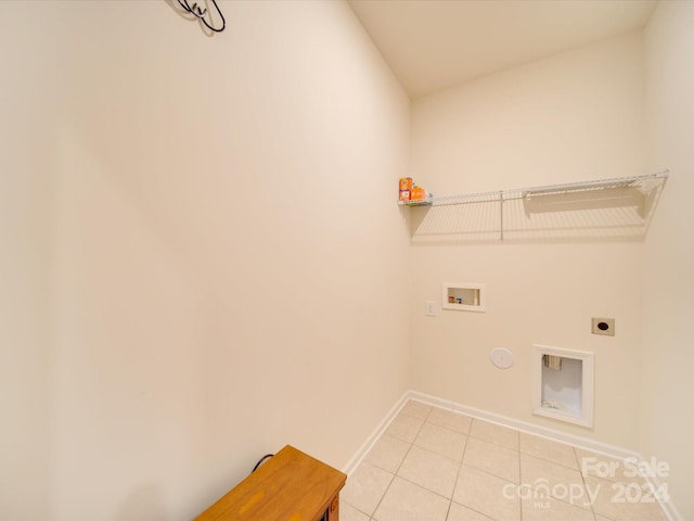 washroom with electric dryer hookup, washer hookup, light tile patterned floors, and hookup for a gas dryer