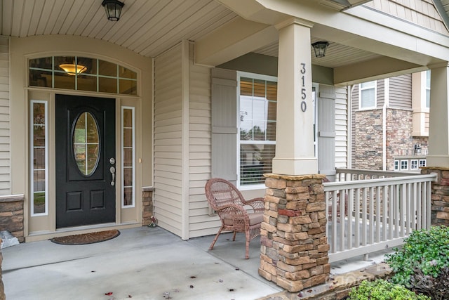 entrance to property featuring a porch