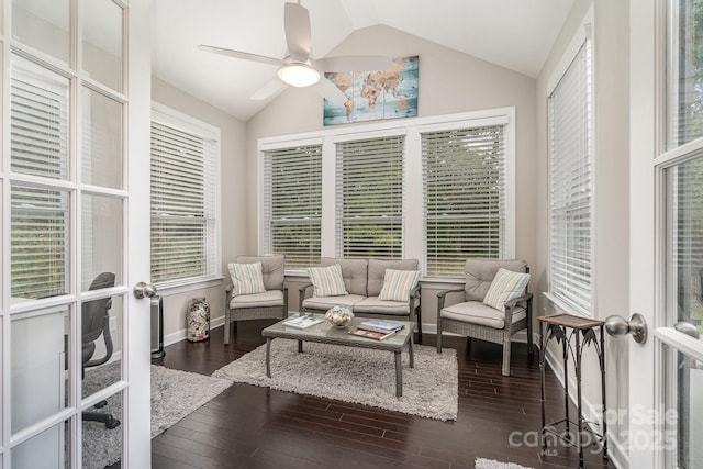 living room featuring lofted ceiling, dark hardwood / wood-style floors, french doors, and ceiling fan