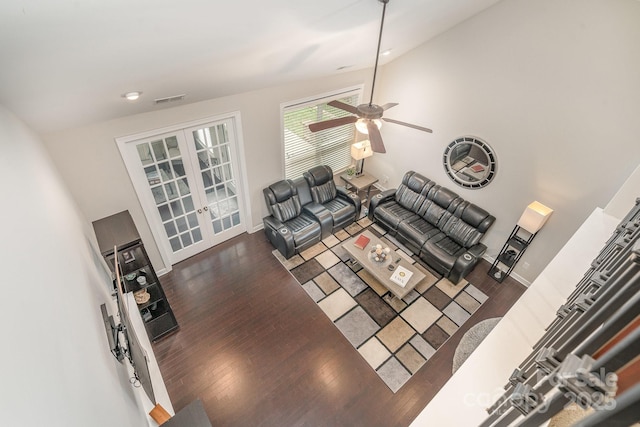 living room with dark wood-type flooring, ceiling fan, and french doors