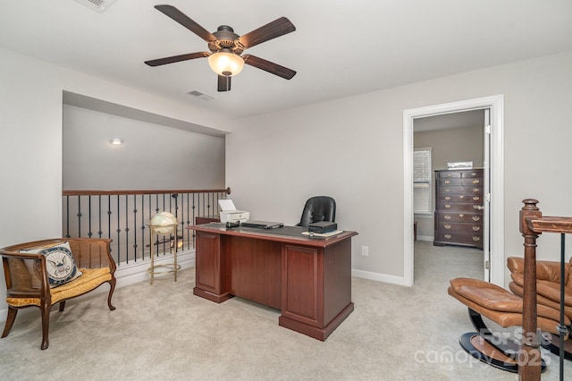 home office with light carpet and ceiling fan