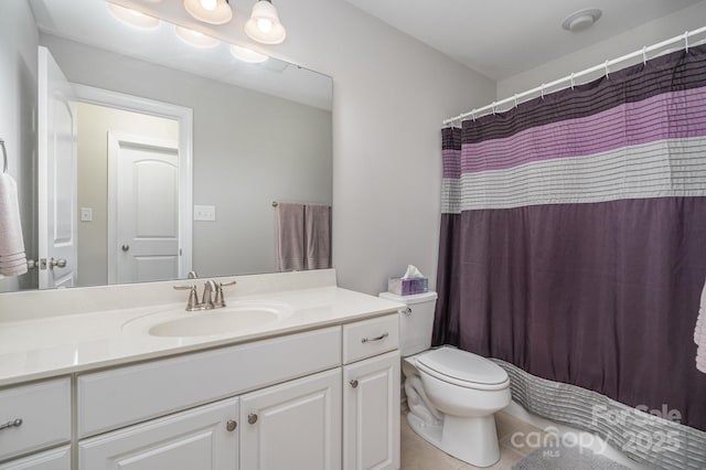 bathroom featuring tile patterned flooring, vanity, walk in shower, and toilet