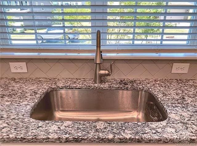 interior details with stone counters and sink