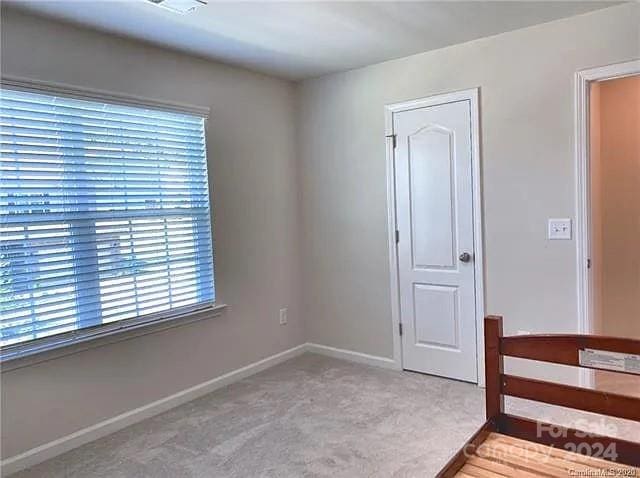 unfurnished bedroom with carpet