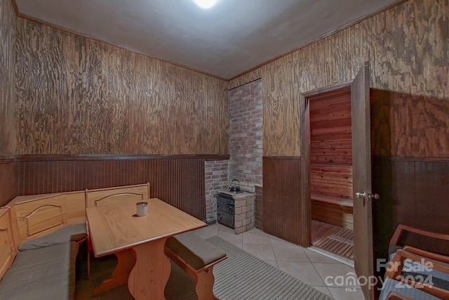 interior space featuring wood walls and tile patterned flooring