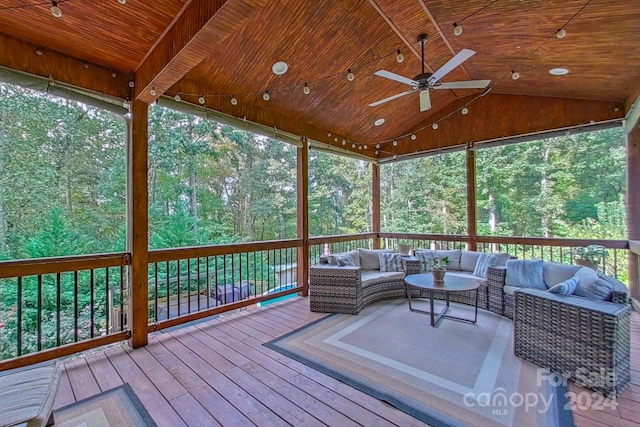 unfurnished sunroom featuring ceiling fan, lofted ceiling, and wooden ceiling