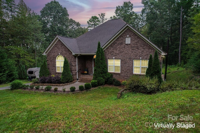 10604 Russet Pl, Charlotte, NC 28227 - view of front of property with brick siding, a front lawn, and roof with shingles