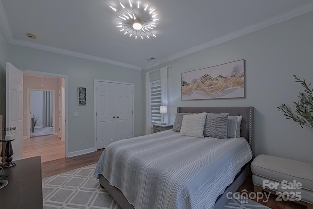 10604 Russet Pl, Charlotte, NC 28227 - bedroom featuring ornamental molding, wood finished floors, and a closet