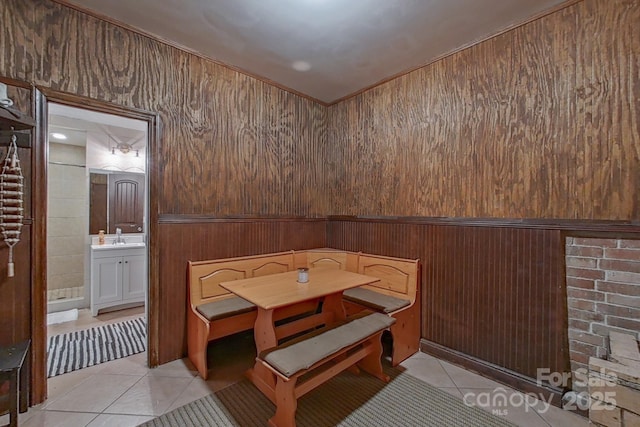 10604 Russet Pl, Charlotte, NC 28227 - dining area with light tile patterned floors and wooden walls