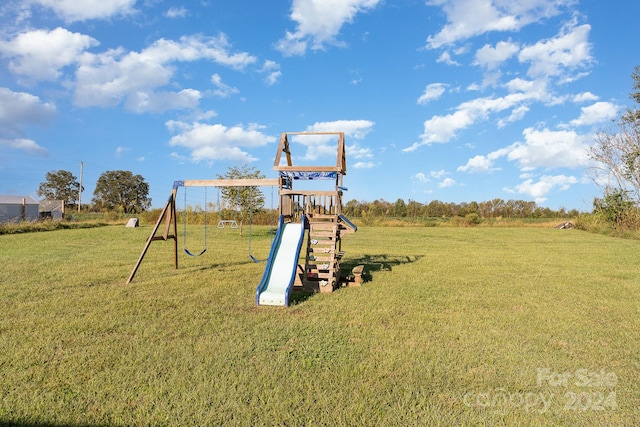 view of play area featuring a lawn