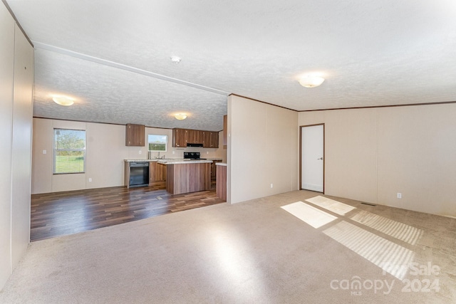 unfurnished living room featuring a textured ceiling and wood-type flooring