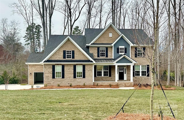 craftsman-style home with a porch, a front yard, and a garage