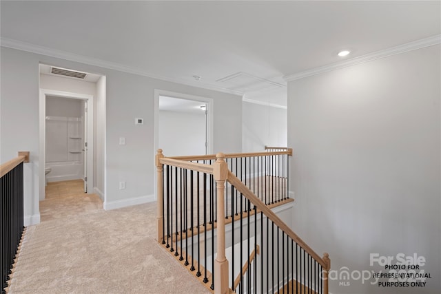 corridor featuring baseboards, light carpet, an upstairs landing, crown molding, and visible vents