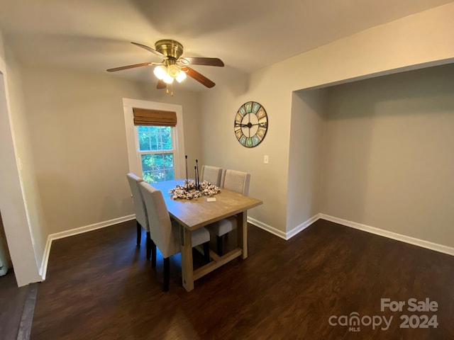 dining room featuring dark wood-type flooring and ceiling fan